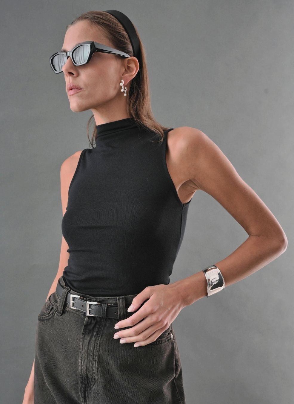 ZA ZEWELZ sculptural earring silver cuff and leather belt worn - quiet luxury jewelry brand